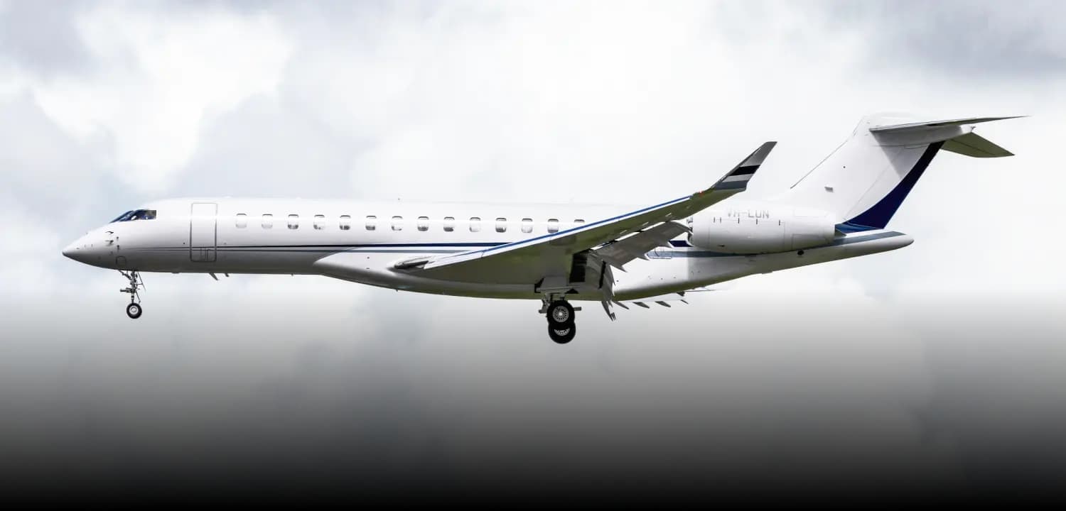 Private jet flying over mountains